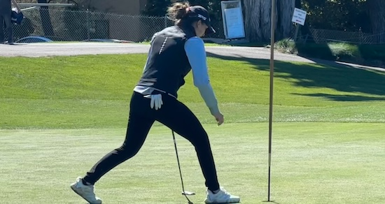 Nicole Iniakov picks her ball out of the hole on No. 9 after making a birdie